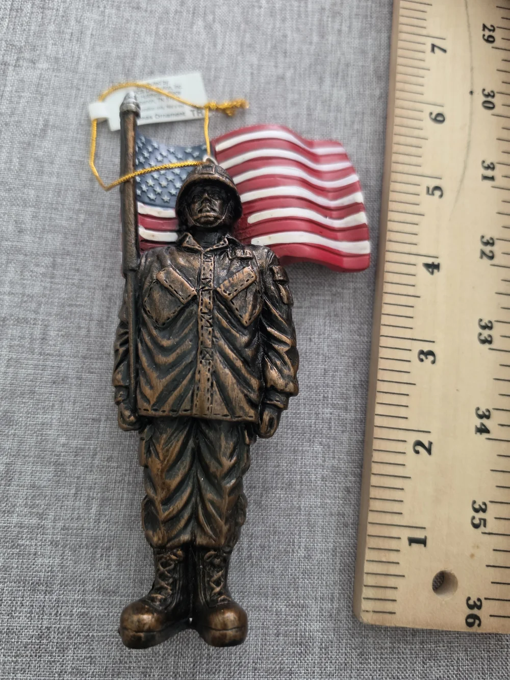 Cracker Barrel Bronze Soldier Ornament with Red, White & Blue Flag